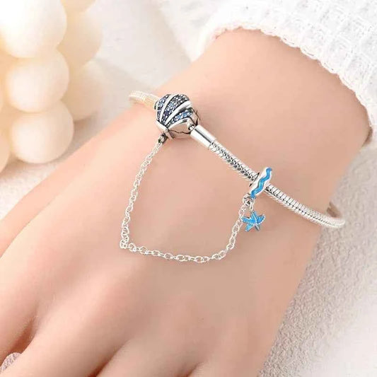 Sterling Silver Seashell Charm Bracelet with Blue CZ Gradient