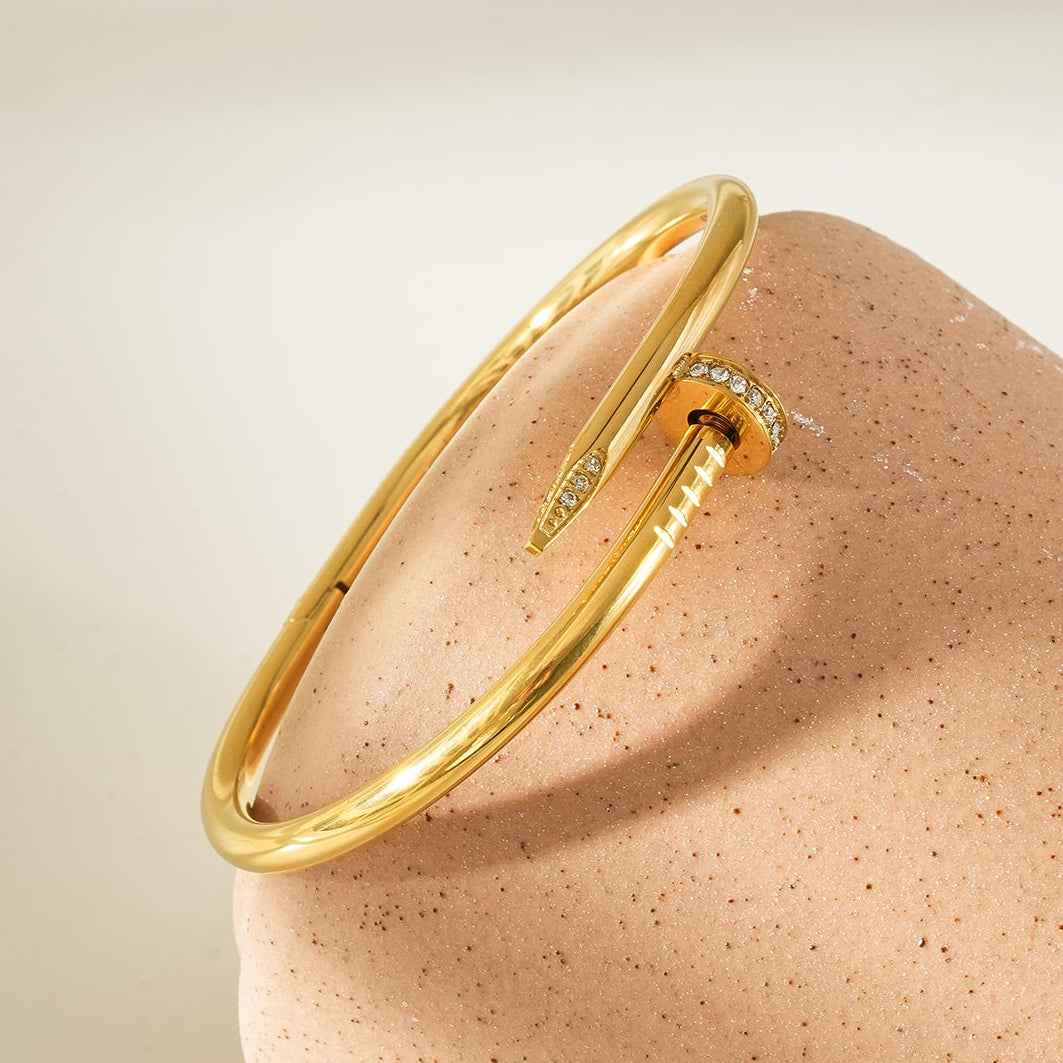 DAVIDKA Gold: Zirconia Embedded Industrial-Chic Twisted Nail Bracelet