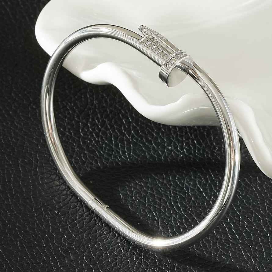 DAVIDKA Silver (White Gold): Zirconia Embedded Industrial-Chic Twisted Nail Bracelet