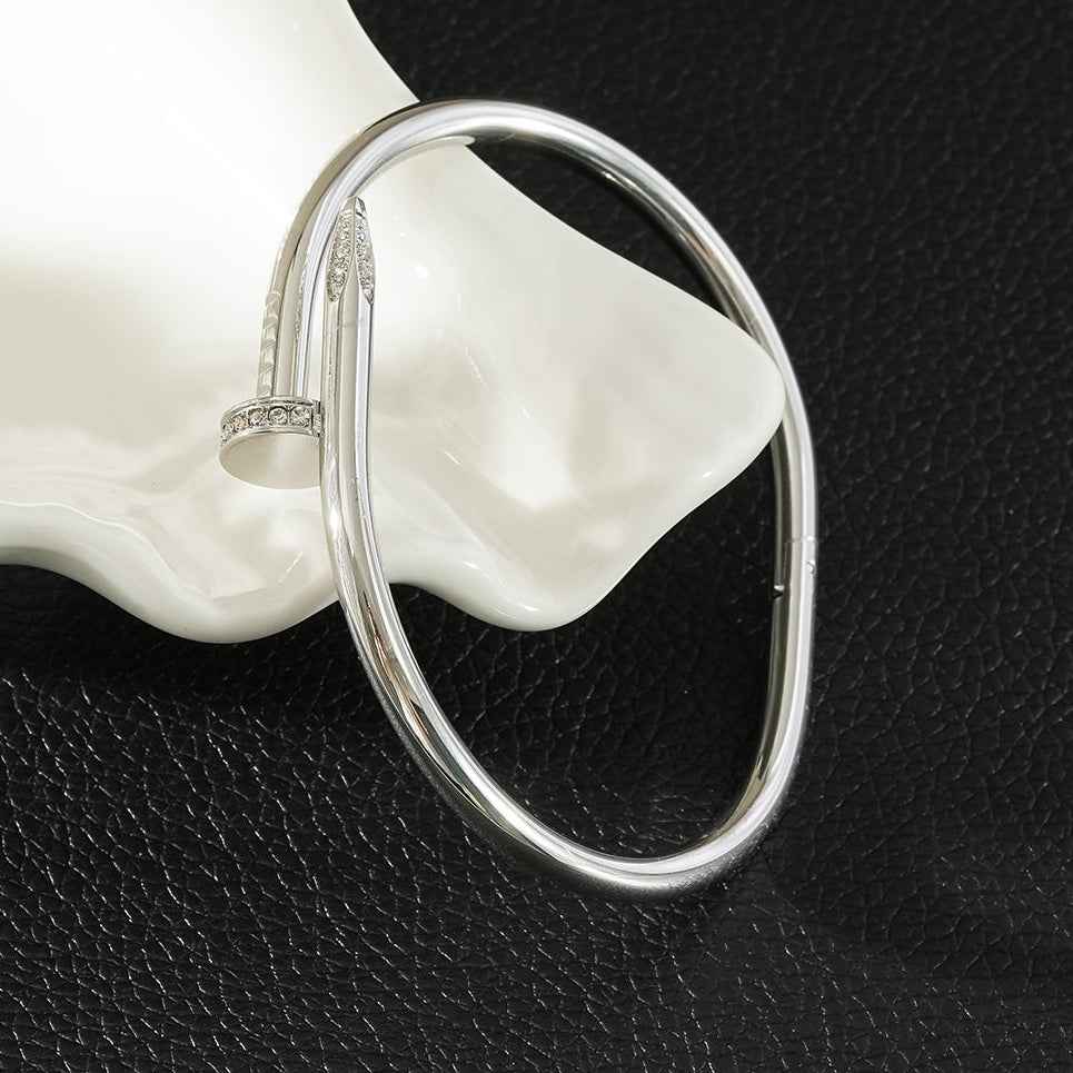 DAVIDKA Silver (White Gold): Zirconia Embedded Industrial-Chic Twisted Nail Bracelet