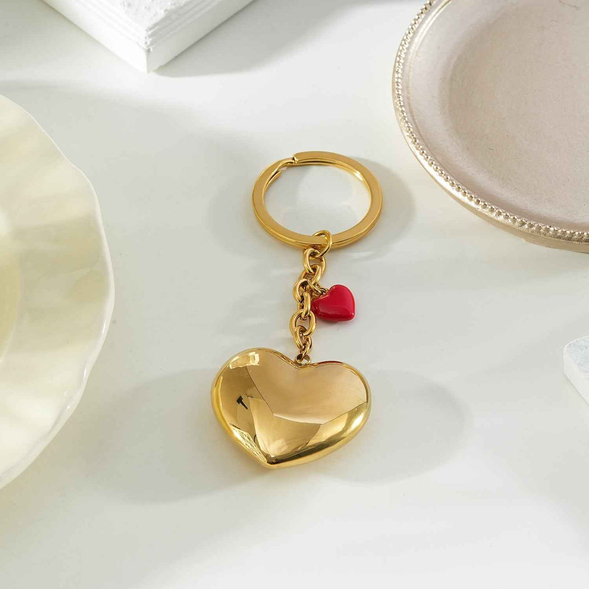 AKAMAI Gold: Golden Heart Charm Key Ring with Red Enamel Accent