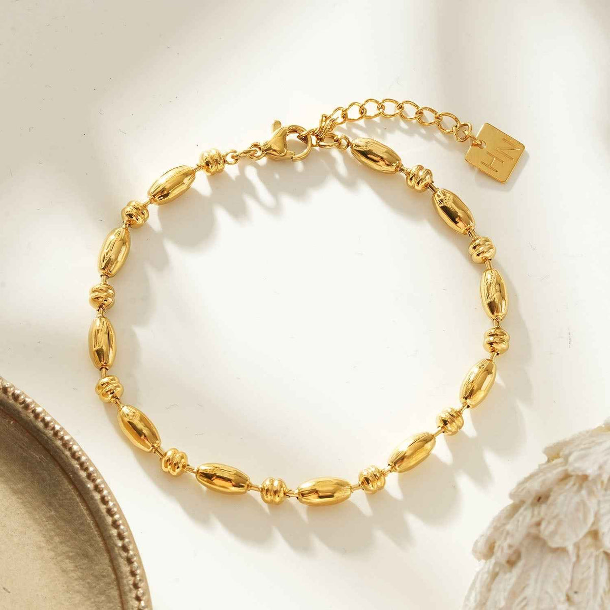 ADIATA Gold: Polished Oval Bead Bracelet – Sculpted Statement Jewellery