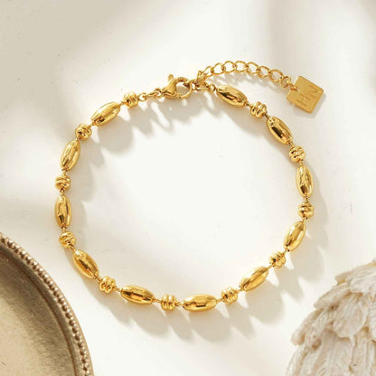 ADIATA Gold: Polished Oval Bead Bracelet – Sculpted Statement Jewellery