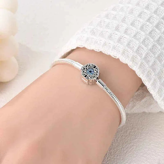 Sterling Silver Celtic Snowflake Charm Bracelet with Blue CZ